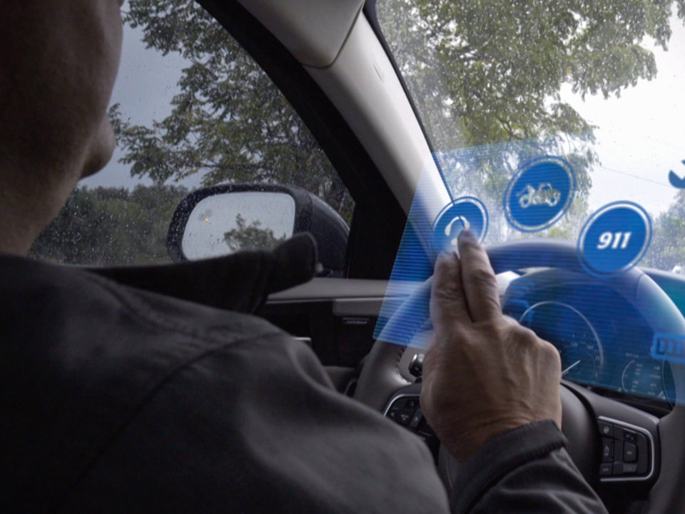 Man using virtual HUD in car
